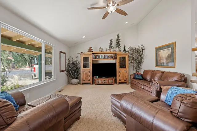 a view of a livingroom with furniture window and wooden floor