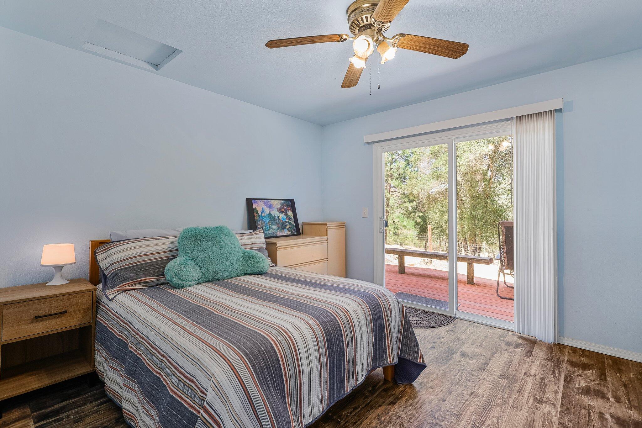 6949 Rector Creek Road Igo, CA 96047 - Photo 75 of 110 a bedroom with a large bed and a large window