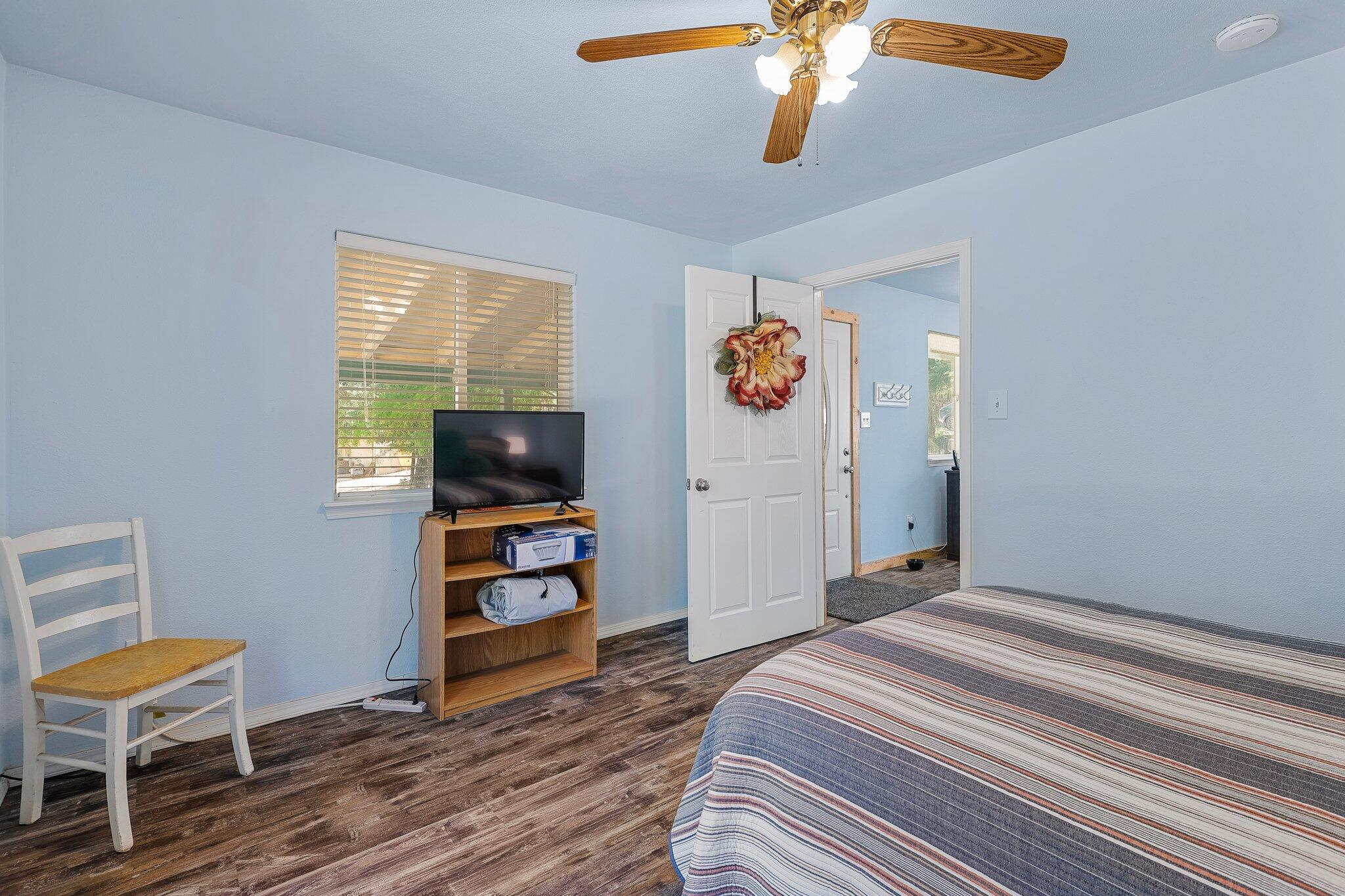6949 Rector Creek Road Igo, CA 96047 - Photo 76 of 110 a bedroom with a bed and a chandelier