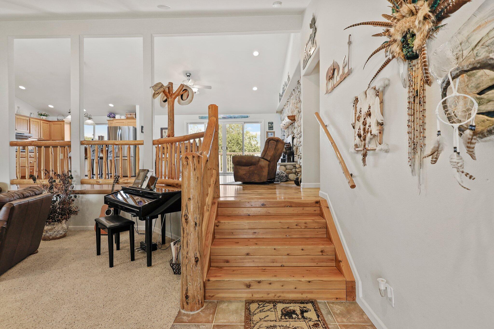 6949 Rector Creek Road Igo, CA 96047 - Photo 8 of 110 a view of a balcony with chairs and stairs