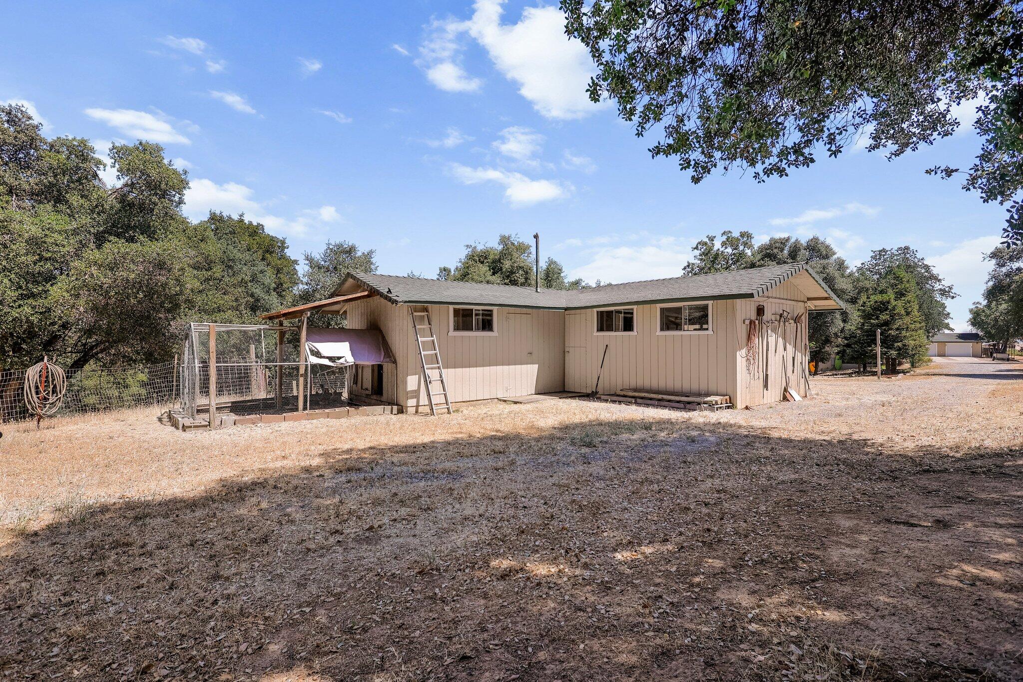 6949 Rector Creek Road Igo, CA 96047 - Photo 86 of 110 a front view of a house with a yard and garage