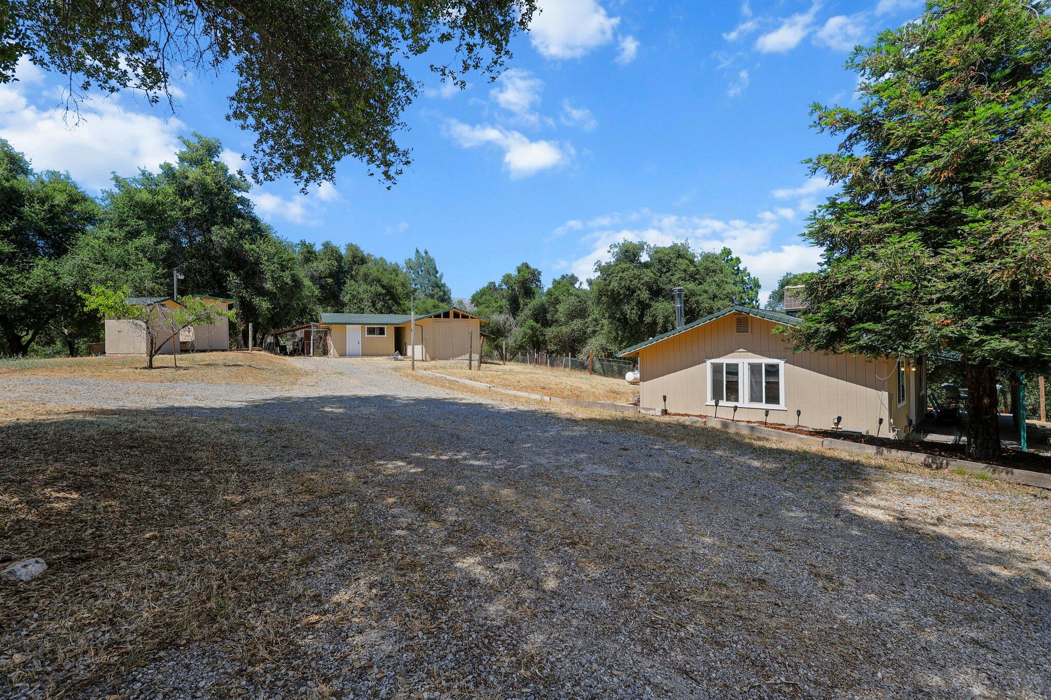 6949 Rector Creek Road Igo, CA 96047 - Photo 90 of 110 a view of an house with backyard space and a tree