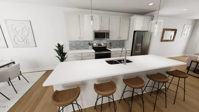 a kitchen with a dining table chairs and refrigerator