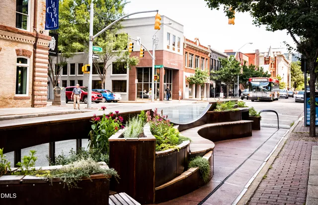 a building outdoor space with patio furniture and potted plants