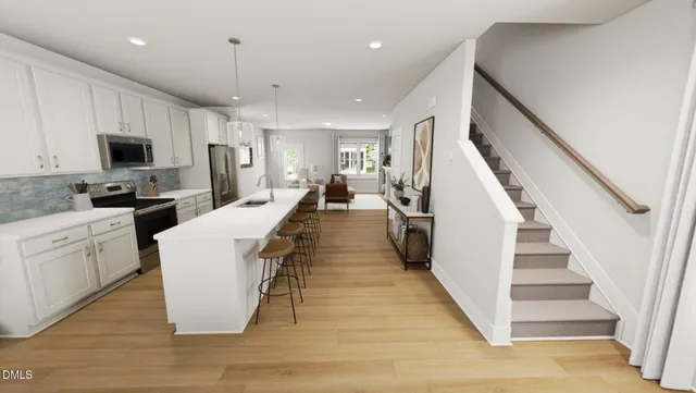 a large white kitchen with a large window