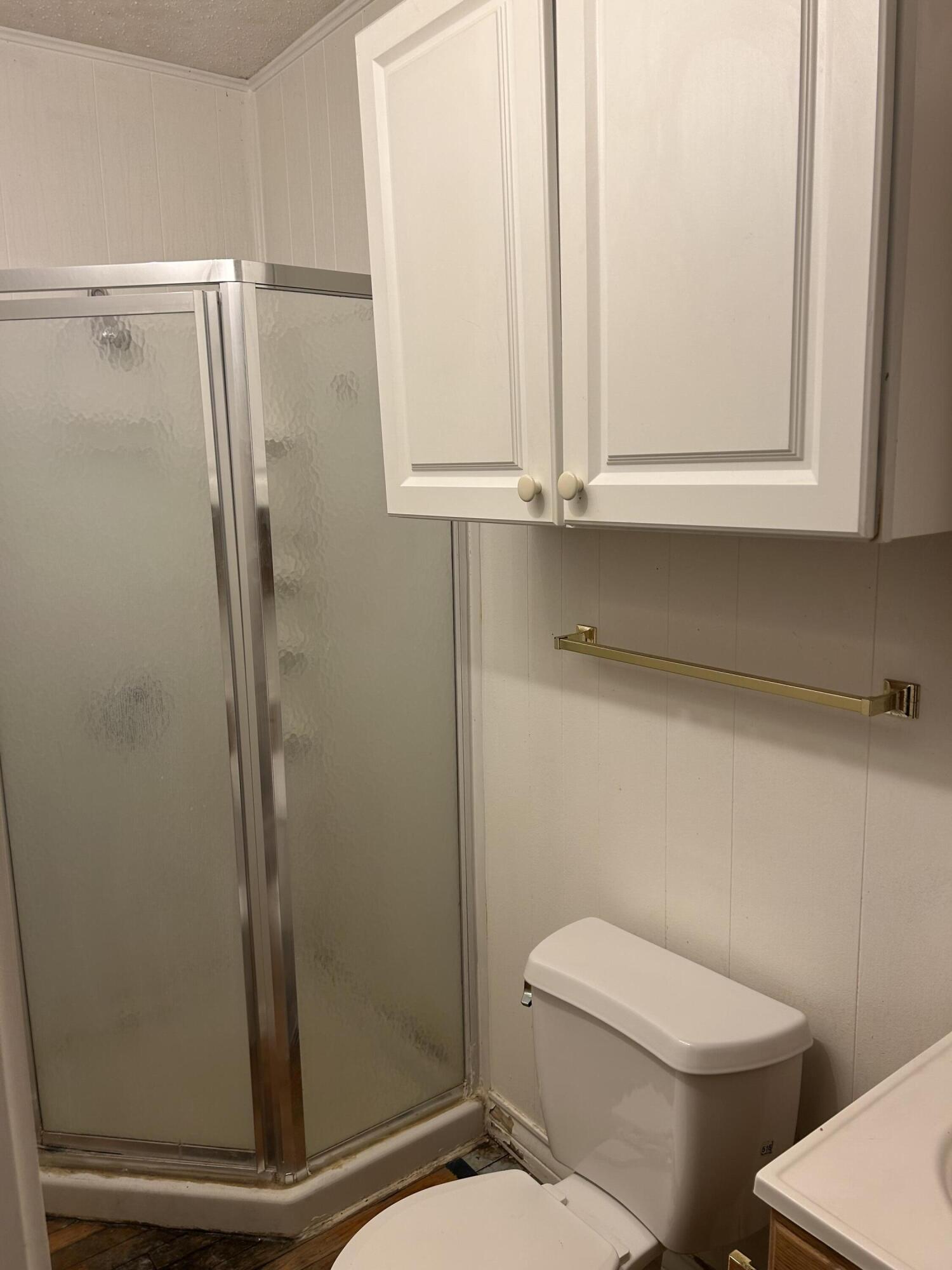 2011 31st Street Lubbock, TX 79411 - Photo 6 of 10 a bathroom with a toilet and a shower