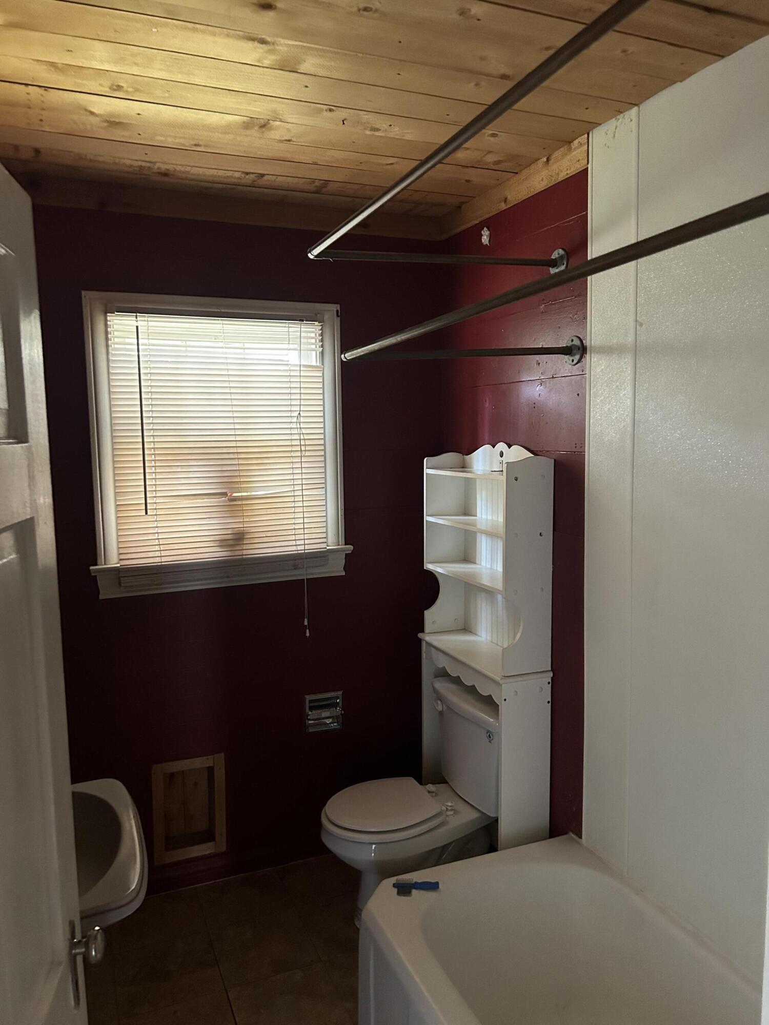 2011 31st Street Lubbock, TX 79411 - Photo 7 of 10 a bathroom with a toilet and a shower