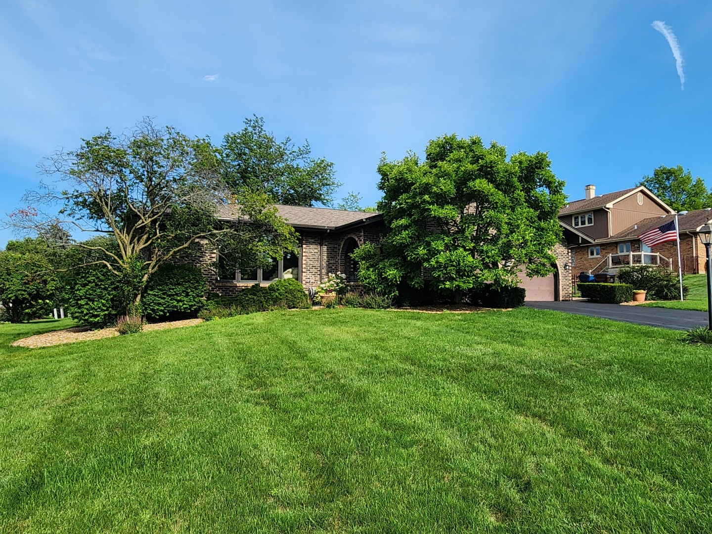 a view of a garden with a house