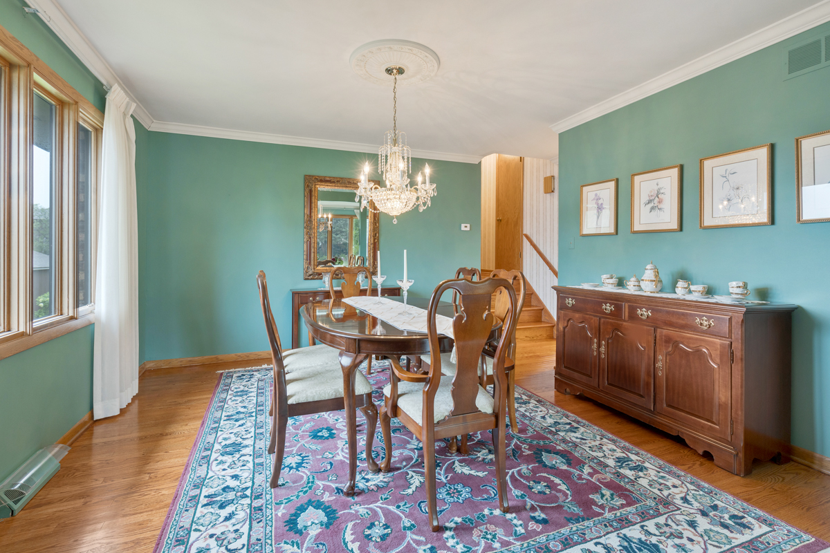 13031 Winnebago Road Palos Heights, IL 60463 - Photo 13 of 31 a dining room with furniture window and wooden floor