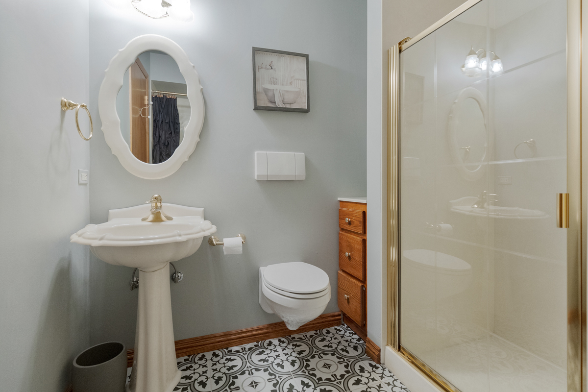 13031 Winnebago Road Palos Heights, IL 60463 - Photo 18 of 31 a bathroom with a toilet sink and shower
