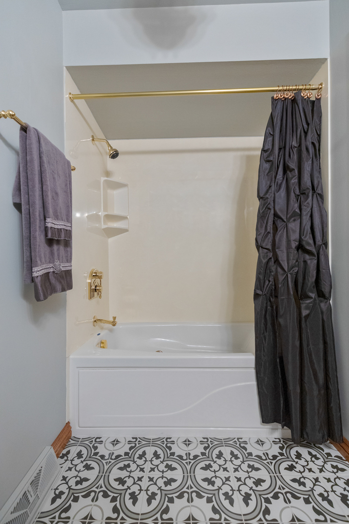 13031 Winnebago Road Palos Heights, IL 60463 - Photo 19 of 31 a bathroom with a shower and a toilet