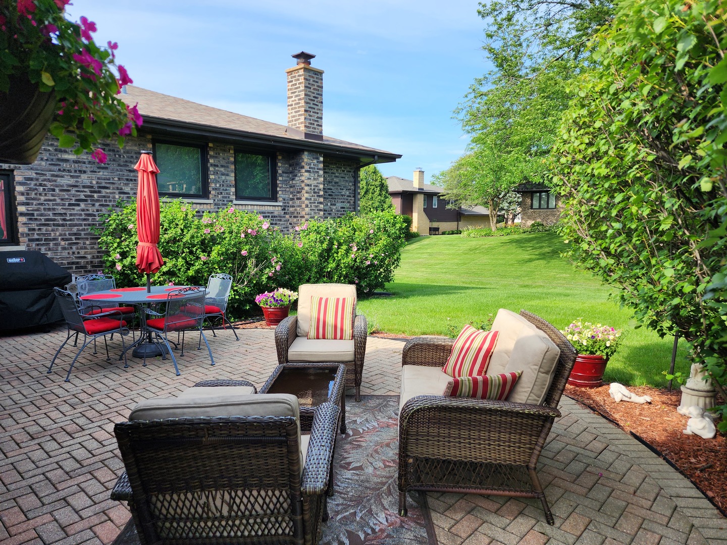 13031 Winnebago Road Palos Heights, IL 60463 - Photo 26 of 31 a view of a patio with couches table and chairs and potted plants