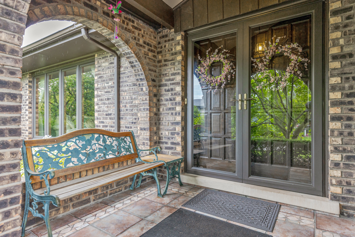 13031 Winnebago Road Palos Heights, IL 60463 - Photo 3 of 31 a bench sitting in front of a building