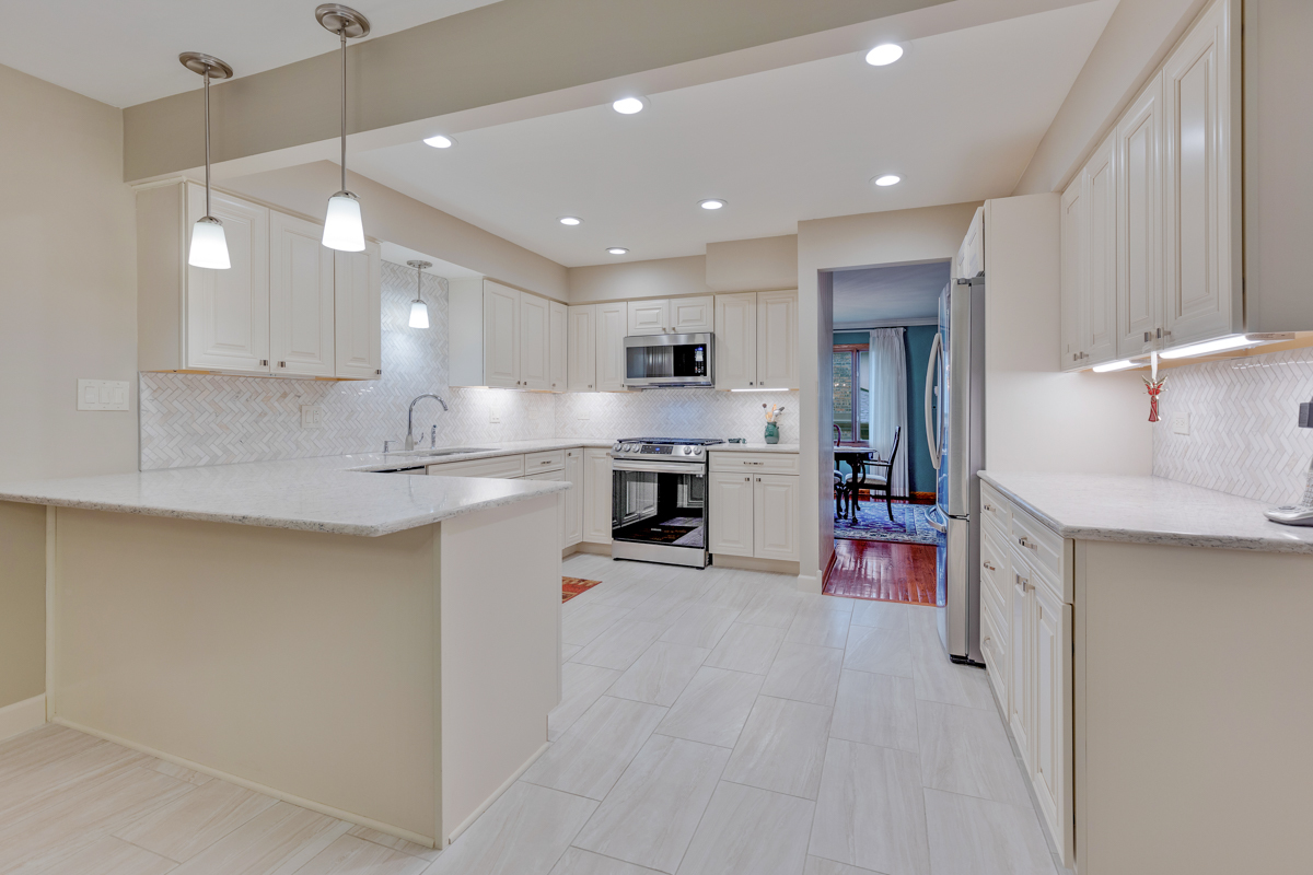 13031 Winnebago Road Palos Heights, IL 60463 - Photo 4 of 31 a kitchen with stainless steel appliances granite countertop a sink refrigerator and cabinets
