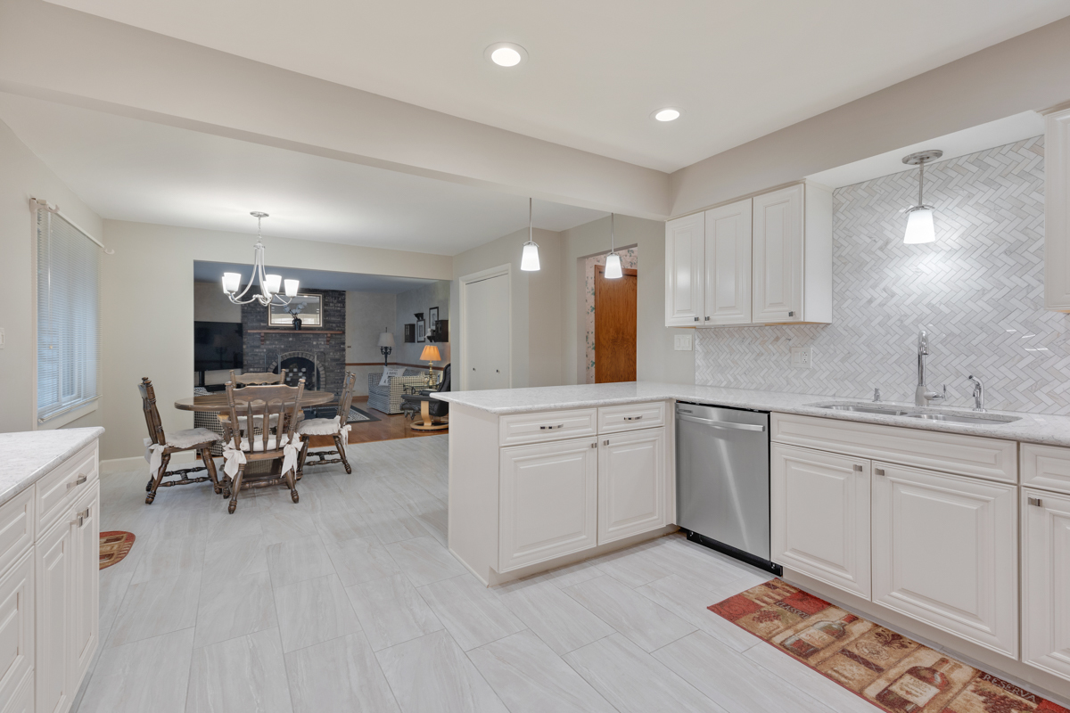 13031 Winnebago Road Palos Heights, IL 60463 - Photo 6 of 31 a kitchen with white cabinets and sink