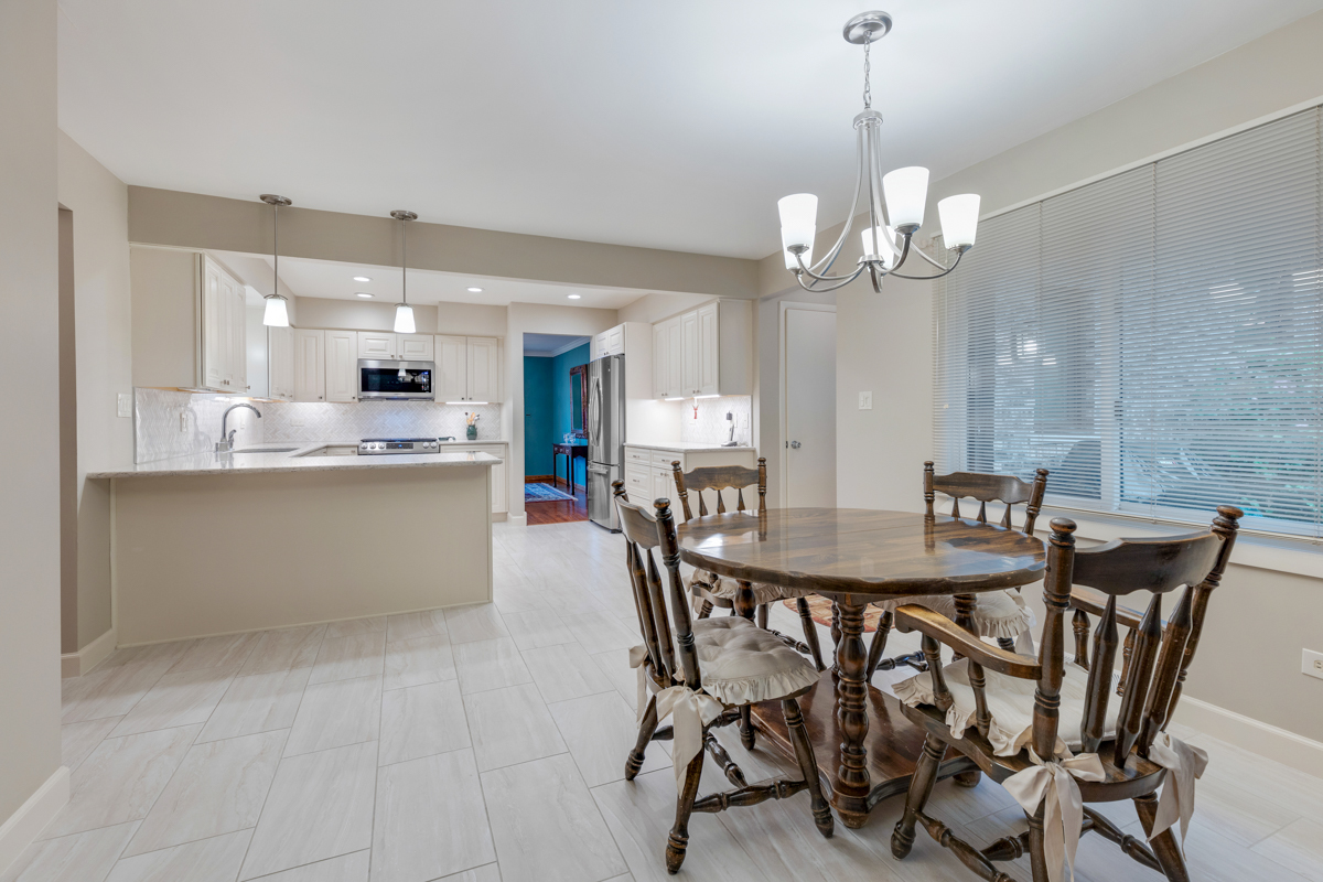 13031 Winnebago Road Palos Heights, IL 60463 - Photo 7 of 31 a view of a dining room and a kitchen with a dining table chairs