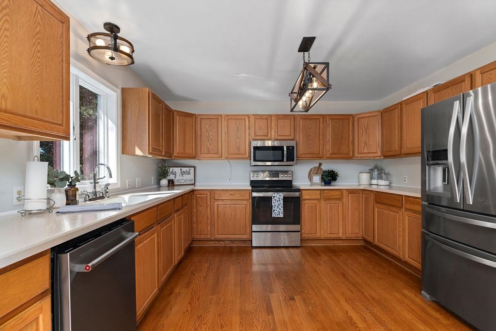 88 Yarmouth Road Stuarts Draft, VA 24477 - Photo 12 of 59 a kitchen with stainless steel appliances a sink cabinets and wooden floor