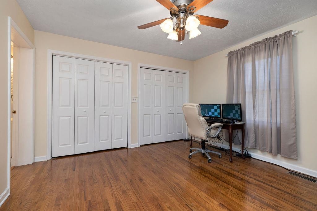 88 Yarmouth Road Stuarts Draft, VA 24477 - Photo 16 of 59 a view of a workspace with wooden floor and a window