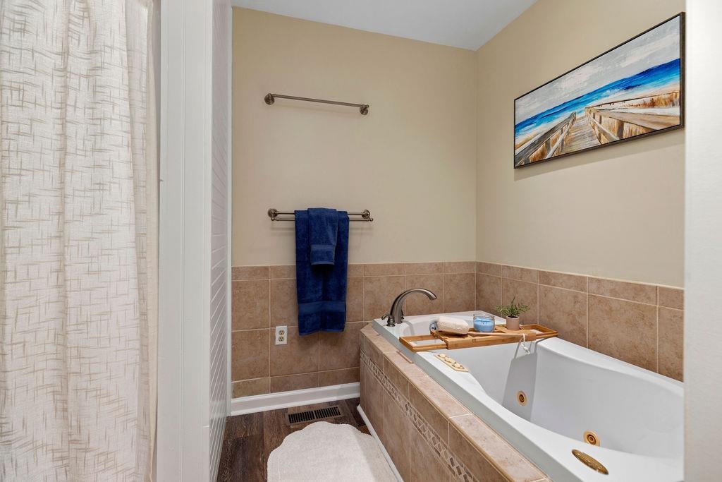 88 Yarmouth Road Stuarts Draft, VA 24477 - Photo 19 of 59 a bathroom with a tub and sink