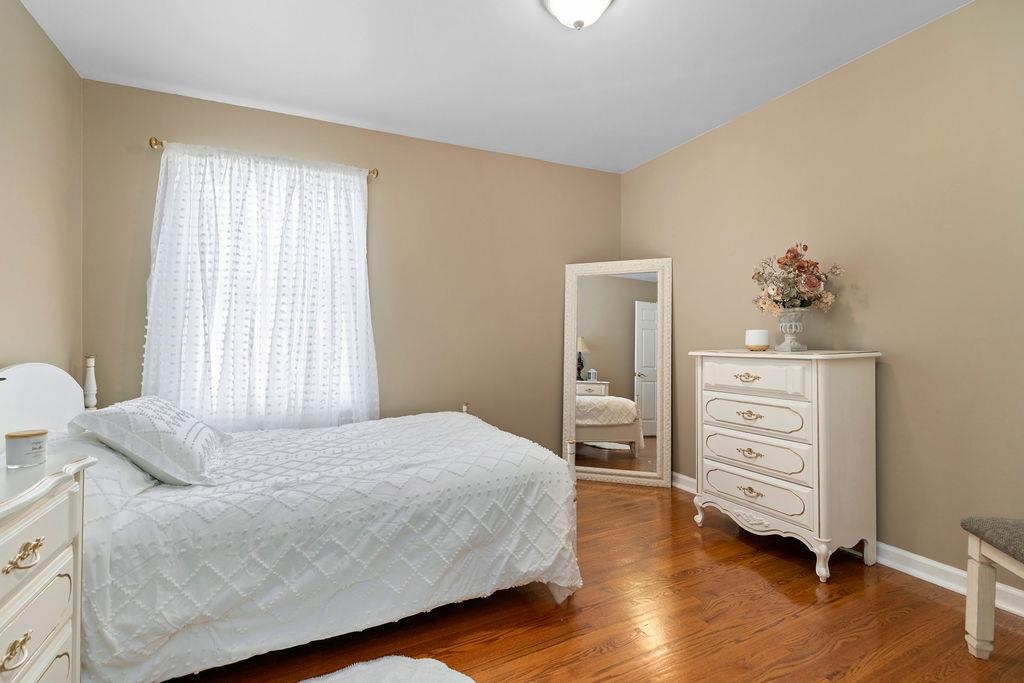 88 Yarmouth Road Stuarts Draft, VA 24477 - Photo 21 of 59 a bedroom with a bed and a dresser
