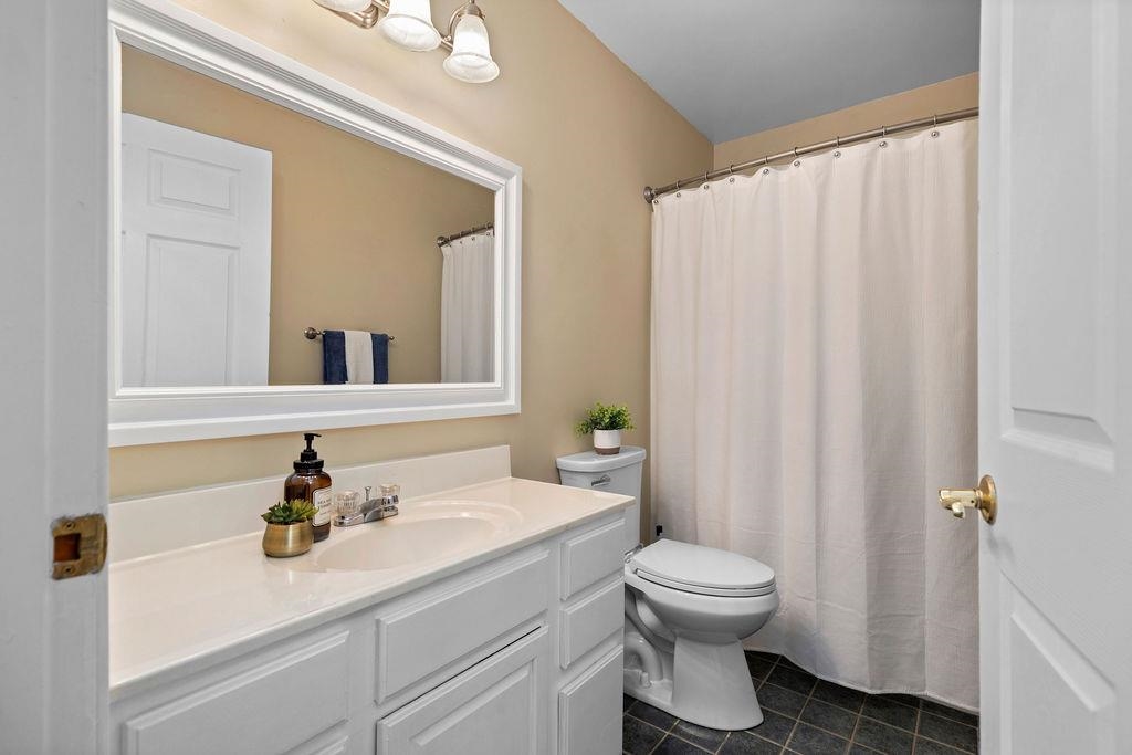 88 Yarmouth Road Stuarts Draft, VA 24477 - Photo 23 of 59 a bathroom with a sink a toilet and a mirror