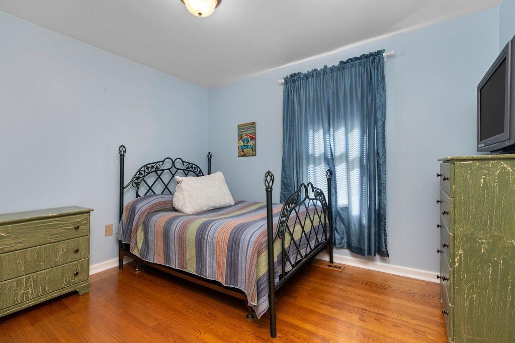 88 Yarmouth Road Stuarts Draft, VA 24477 - Photo 24 of 59 a bed room with a bed and a tv