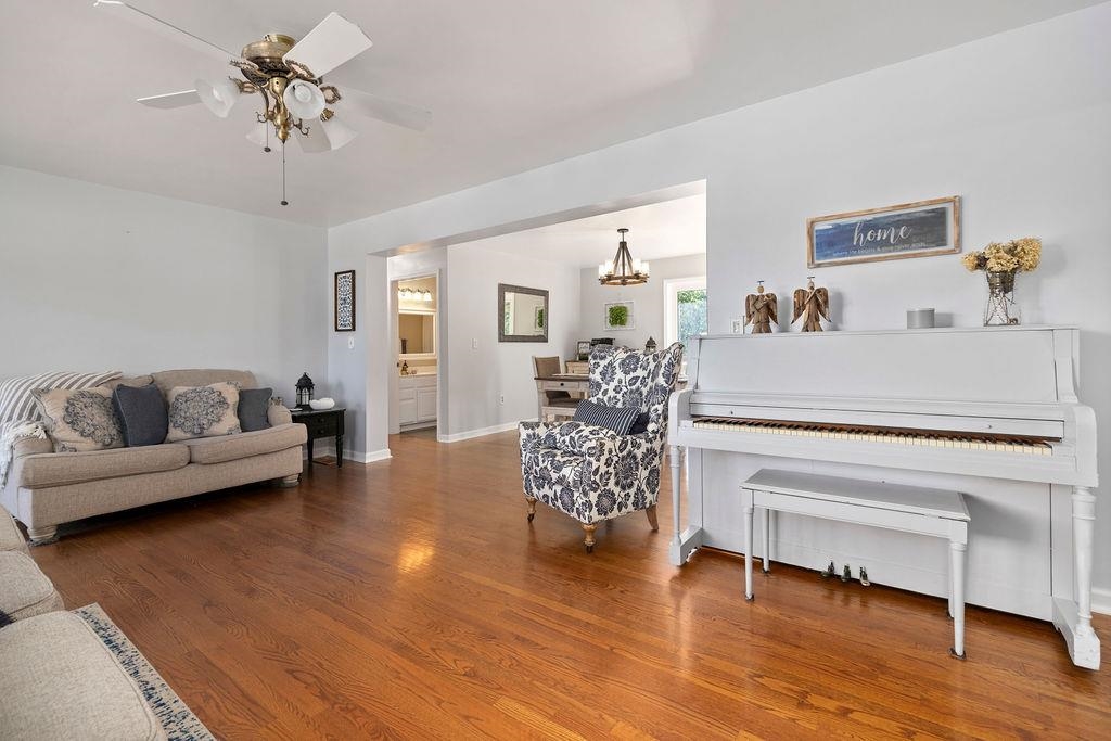 88 Yarmouth Road Stuarts Draft, VA 24477 - Photo 5 of 59 a living room with furniture and a chandelier