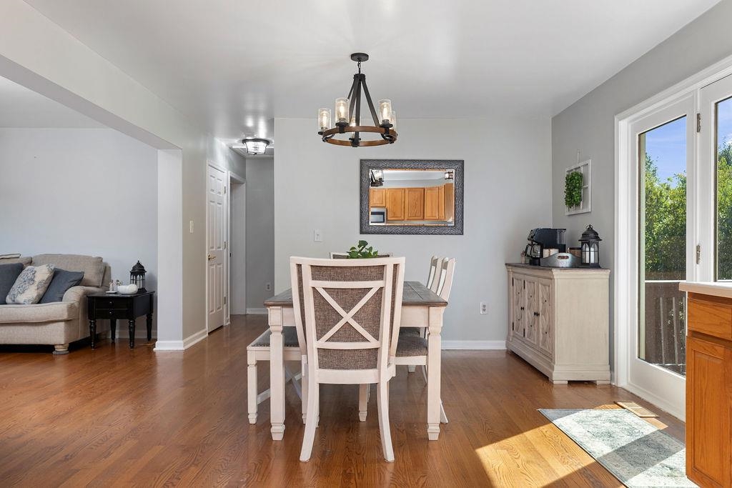 88 Yarmouth Road Stuarts Draft, VA 24477 - Photo 9 of 59 a view of a dining room with furniture wooden floor and a chandelier