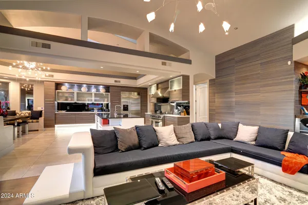 a living room with furniture and view of couch