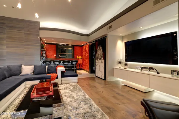 a living room with furniture and a flat screen tv