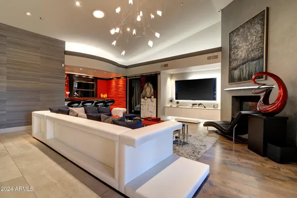 a room with furniture and flat screen tv