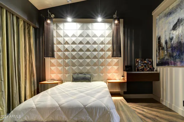 a bedroom with a bed and a view of balcony