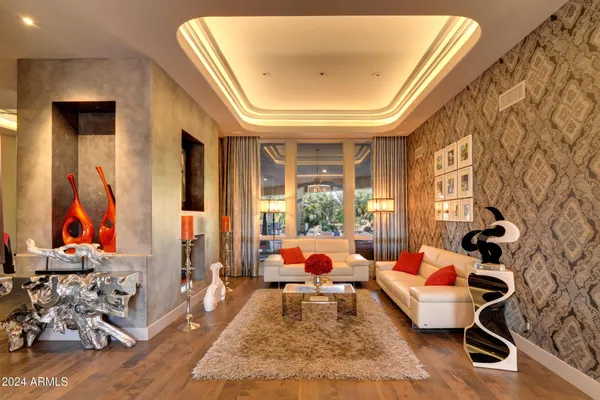a living room with furniture and a large window