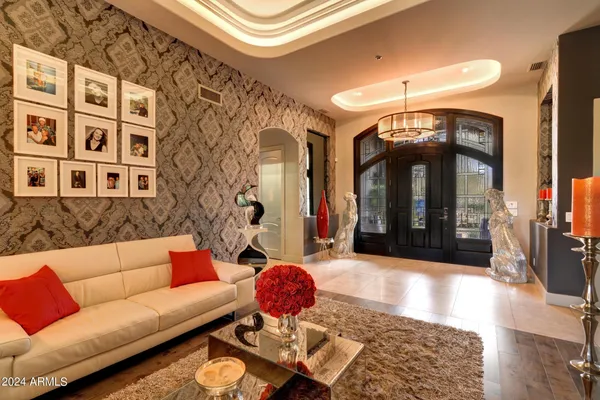 a living room with furniture and dining area