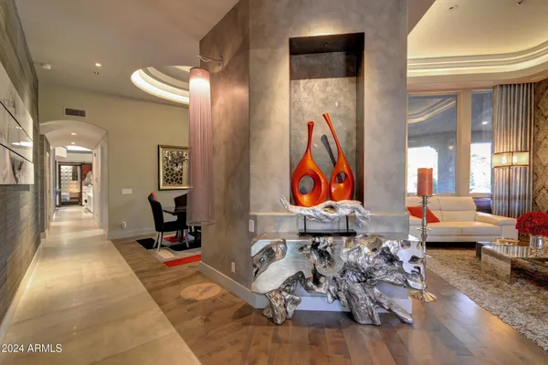 a room with lots of furniture and wooden floor