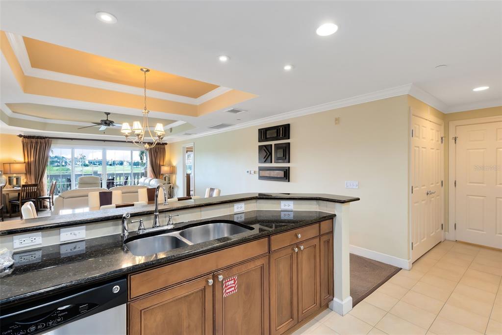 1360 Centre Ct Ridge Drive, Unit 201 Reunion, FL 34747 - Photo 16 of 29 a kitchen with a sink and large window