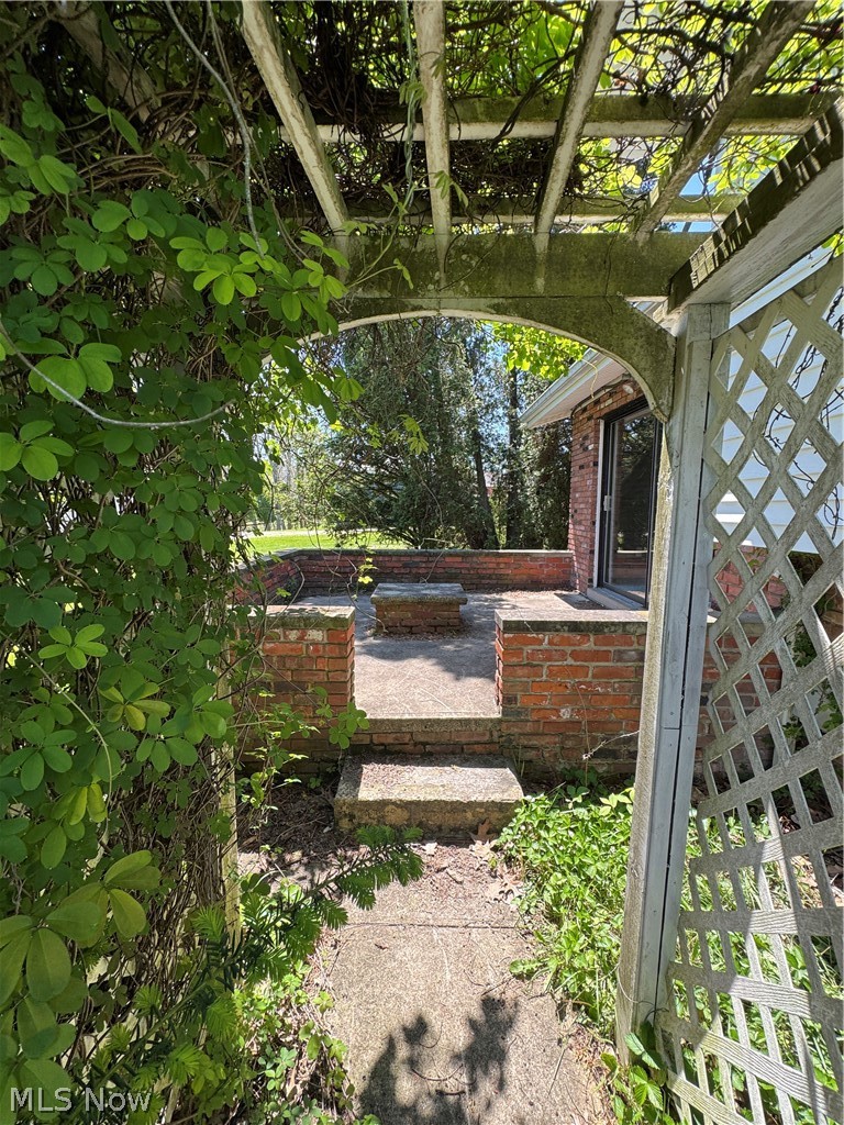 2705 Columbia Road Medina, OH 44256 - Photo 42 of 48 View of garden arbor on backyard sidewalk unto backyard patio