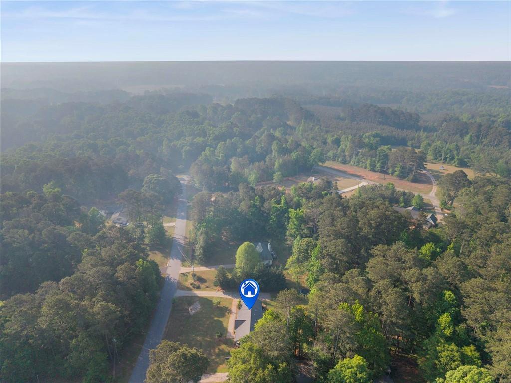 2777 Chickadee Drive Monroe, GA 30655 - Photo 34 of 36 an aerial view of a house with a yard and tree s