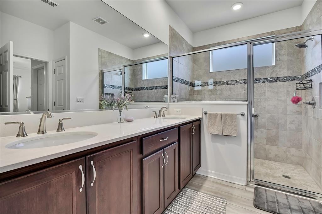 9764 Southwest 100th Avenue Ocala, FL 34481 - Photo 22 of 37 a kitchen with a sink and a refrigerator