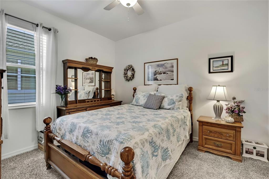 9764 Southwest 100th Avenue Ocala, FL 34481 - Photo 23 of 37 a bedroom with bed and window