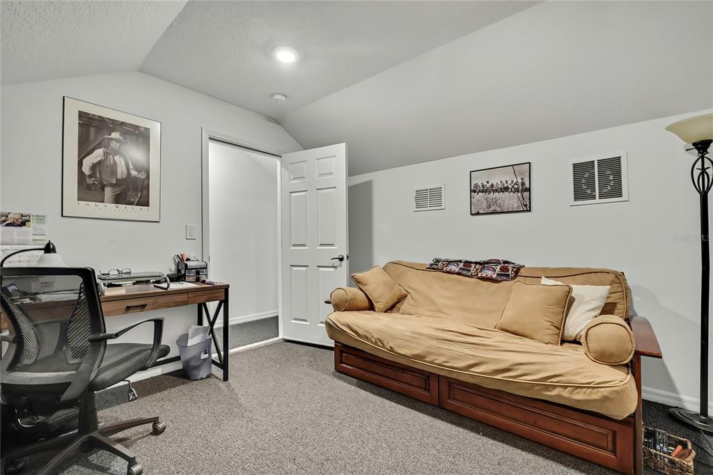 9764 Southwest 100th Avenue Ocala, FL 34481 - Photo 29 of 37 a living room with furniture and a air conditioner vent