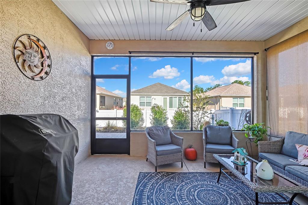 9764 Southwest 100th Avenue Ocala, FL 34481 - Photo 30 of 37 a living room with furniture and a large window