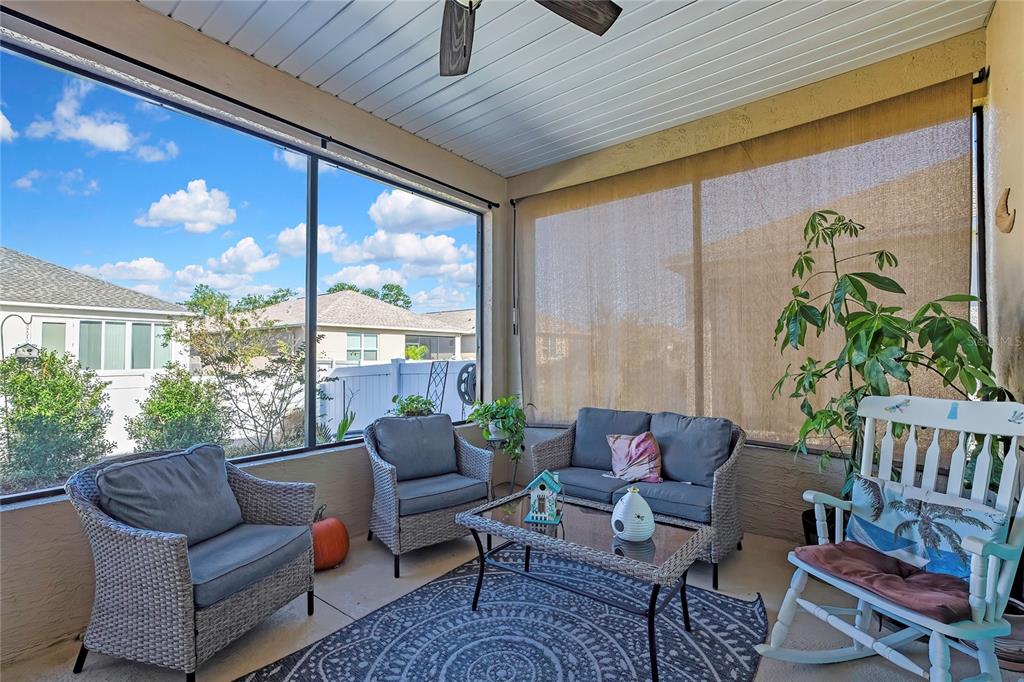 9764 Southwest 100th Avenue Ocala, FL 34481 - Photo 31 of 37 a living room with furniture and a large window