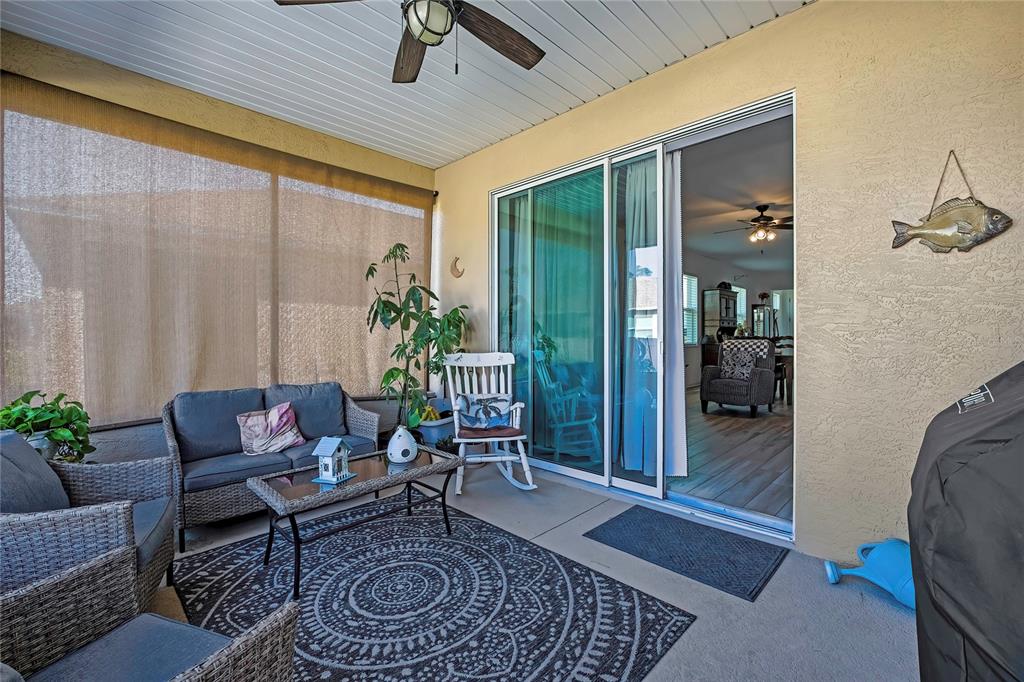 9764 Southwest 100th Avenue Ocala, FL 34481 - Photo 32 of 37 a living room with furniture and a potted plant