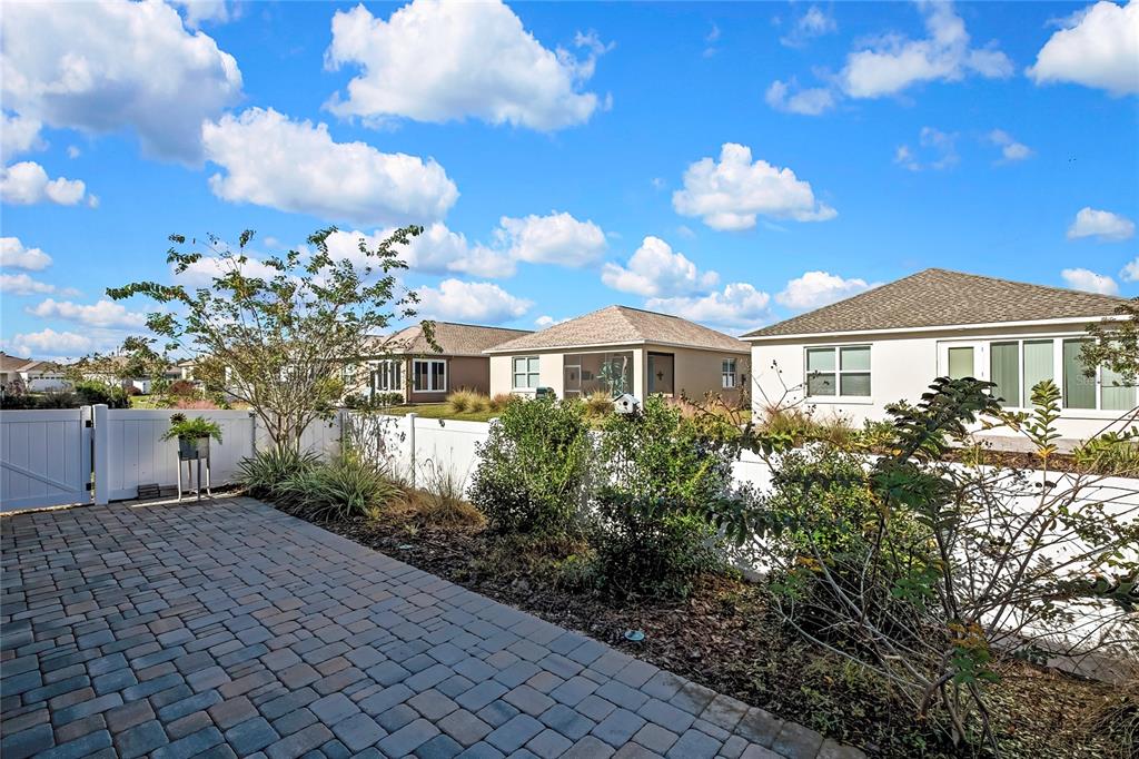 9764 Southwest 100th Avenue Ocala, FL 34481 - Photo 34 of 37 a front view of a house with a yard