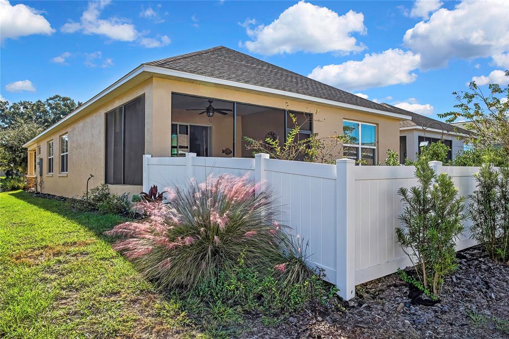 9764 Southwest 100th Avenue Ocala, FL 34481 - Photo 35 of 37 a front view of house with yard and trees
