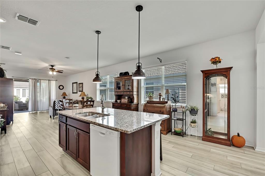 9764 Southwest 100th Avenue Ocala, FL 34481 - Photo 8 of 37 a kitchen with a sink and stove