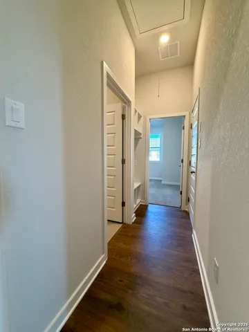 a view of wooden floor and an entryway