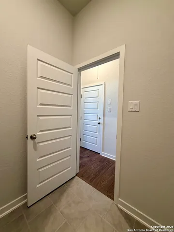 a large kitchen with stainless steel appliances kitchen island a large counter top and a view of living room