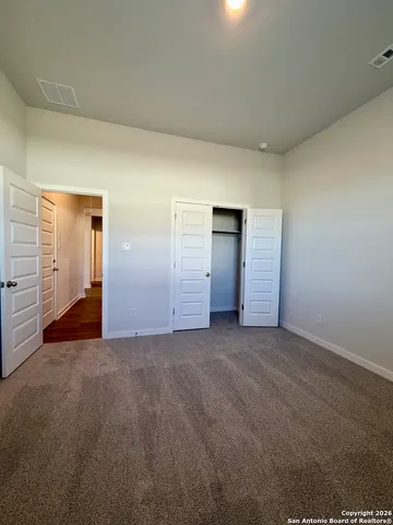 a kitchen with kitchen island a sink and wooden floor